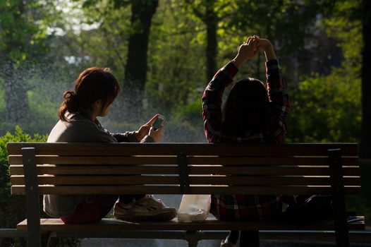 bench-people-smartphone-sun-medium
